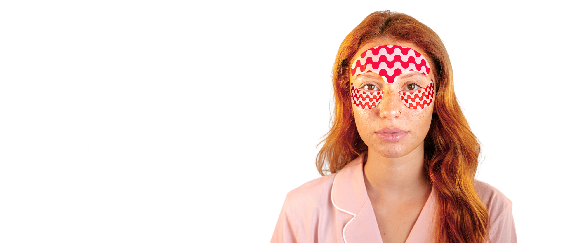 Woman wearing a red and white zigzag patterned eye mask on a white background